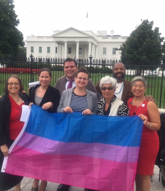 Group photo on White House lawn holding bisexual banner